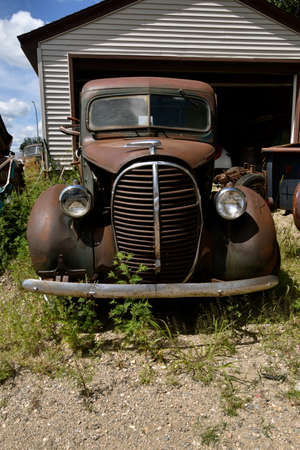 BARNESVILLE, MINNESOTA, July 23, 2020: The pickup grill and front from the 40`s is a Chevrolet, colloquially referred to as Chevy and formally the Chevrolet Division of General Motors Company.のeditorial素材