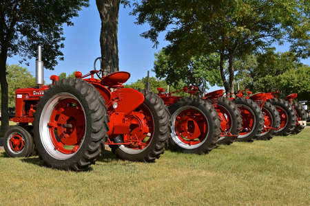HURON, SOUTH DAKOTA, August 6, 2020:  The restored row of  B, and M Farmalls are displayed at the National Red Power Roundup Show in Huron featured Farmalls and International Harvester farm equipment.のeditorial素材