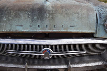 LAKE PARK MINNESOTA, October 2, 2020: The rusty grill, hood, and logo is that of a 1957 Buick...