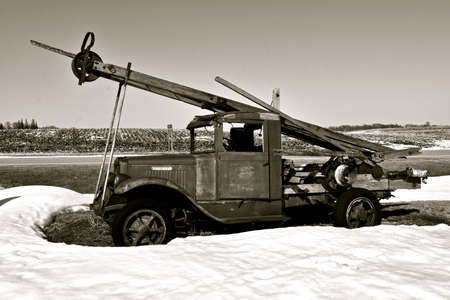 DALTON, MINNESOTA, MARCH 5, 2021: The old International truck with an extended boom is a product of...