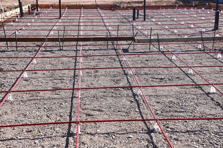 Rebar creates square grid pattern on the creation of a pad for a new hbuildingの写真素材