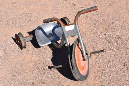 A very old kids tricycle with an aluminum seatの写真素材