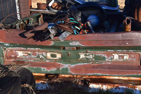 FIRESTEEL, SOUTH DAKOTA, April 26, 2021: The logo on the back of a pickup loaded with scrap iron is a product of the Ford Motor Company located in Dearborn, Michigan started by Henry Ford and incorporのeditorial素材