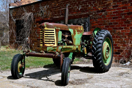 SELBY, SOUTH DAKOTA, April  27, 202:The retired Super 77 old tractor is a product from Oliver Farm Equipment Company which was purchased by White Motor Corporation in 1960.のeditorial素材