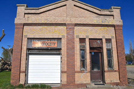 An old grocery store in a small village converted into a garageの写真素材
