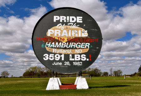 RUTLAND, NORTH DAKOTA, May 9, 2021:  The billboard found in Rutland, ND advertises the World's largest hamburger ever made at 3,591 pounds in their centennial celebrationのeditorial素材