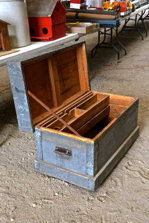 An old wooden toolbox for a carpenter is in a lineup at an auction.の写真素材