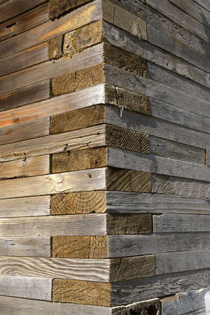 The corner of an old grain elevator displays how the 2x8 boards are laid interlocking  and flat upon each other for added strength.の写真素材