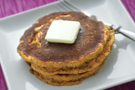 Stack of fresh homemade pancakes with butter