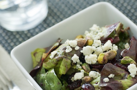 Salad with red and green lettuce vinaigrette nuts berries and blue cheeseの写真素材