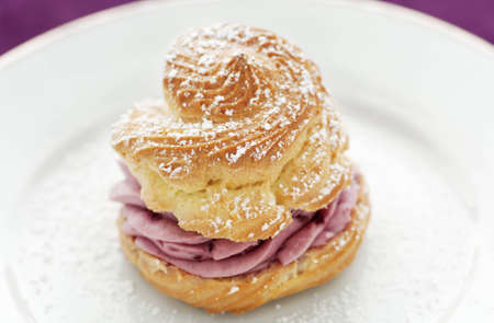 Gourmet pastry cream puff with raspberry cream