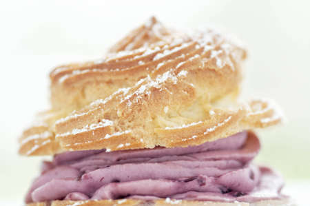 Gourmet pastry cream puff with raspberry creamの写真素材