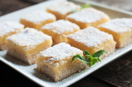 Fresh baked Meyer lemon bars with powdered sugarの写真素材