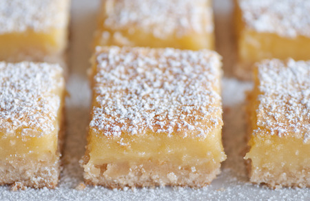 Fresh baked Meyer lemon bars with powdered sugarの写真素材