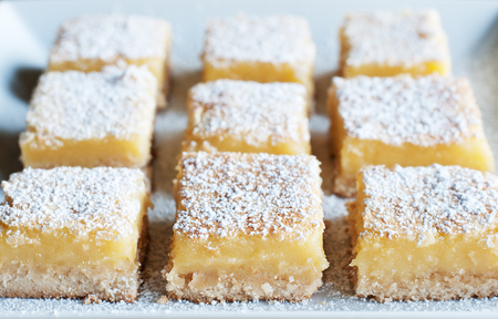 Fresh baked Meyer lemon bars with powdered sugarの写真素材