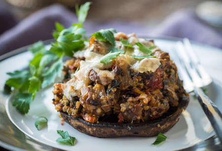 Large portobello muchroom stuffed with quinoa and sundried tomatoesの写真素材
