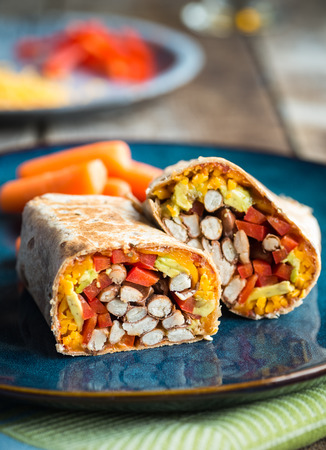 Quick burrito with red bell pepper avocado and cheeseの写真素材