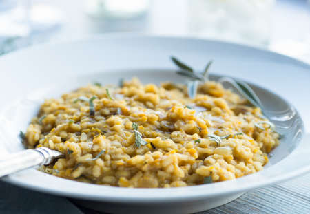 Autumn squash risotto with fresh sageの写真素材