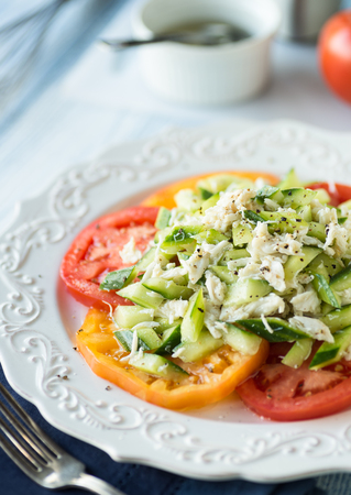 Light tuna salad with fresh cucumber and heirloom tomatoesの写真素材