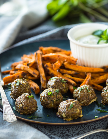 Spicy meatballs with sweet potato friesの写真素材