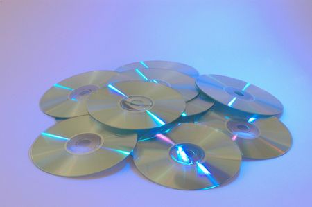 cd roms laid out with a blue purple background