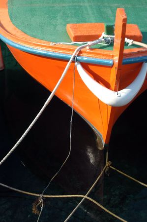 bow of orange boatの写真素材