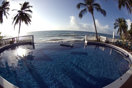 luxury infinity swimming pool with raft float caribbean sea resort ...