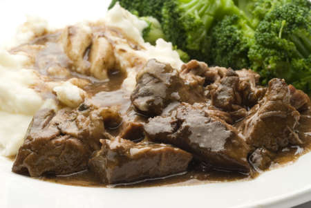 angus beef pot roast with gravy mashed potatoes and broccoliの写真素材