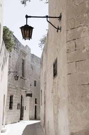 mdina malta alley street ancient medieval town old architecture with maltese street lampの写真素材