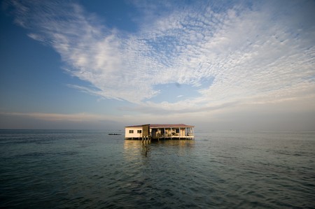 restaurant on stilts in Caribbean Sea Nicaragua after storm lacking bridge to structure destroyed...