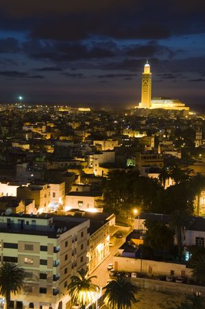 Hassan II mosque night scene at dusk sundown with lights overlooking the Atlantic Ocean in Casablanca Morocco Africa which is the largest mosque in Morocco and the third largest mosque in the worldの写真素材