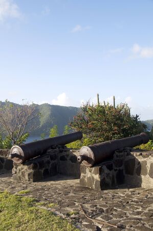 old canons at fort hamilton overlooking admiralty bay caribbean sea in the island of bequia st. vincent and the grenadinesの写真素材