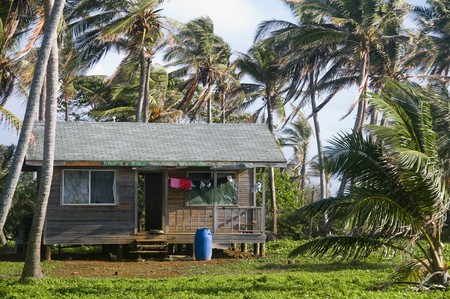 basic simple beach house cabana in Nicaragua Corn Island jungle with laundry drying in windの写真素材