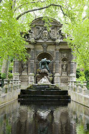 the Medicii Fountain La fontaine Medicis in Luxembourg Gardens Paris France with sculptures of the giant Polyphemus surprising the lovers Acis and Galateaの写真素材