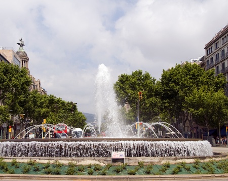 Barcelona Spain fountain Gran Via and Paseo de Gracia with garden flowers parkのeditorial素材