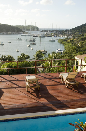 view English Harbor Antigua island Caribbean Sea from deck with swimming poolのeditorial素材