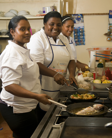 Big Corn Island, Nicaragua-April 2: Cooks and kitchen staff are seen cooking fish and vegetables in hotel in Big Corn Island, Nicaragua, Central America on April 2, 2014.のeditorial素材