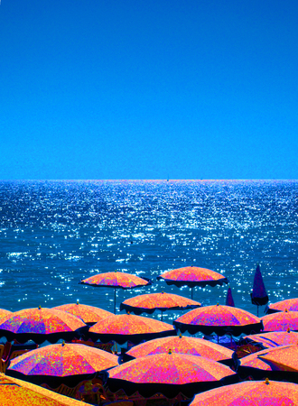 umbrellas on beach in Nice, France The French Rivieraの写真素材