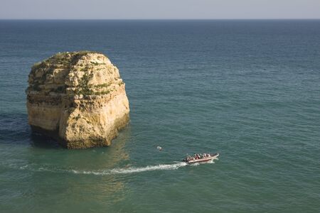 Boat in a beautiful seascape at Algarve region, Portugalの写真素材
