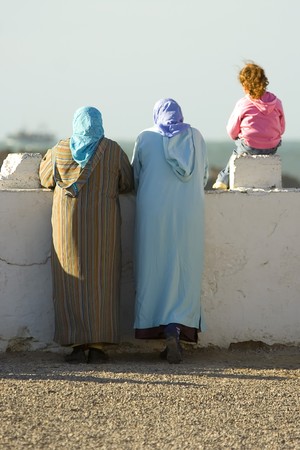 womwn standing on a Essaouira port and looks into the ocean, Moroccoの写真素材