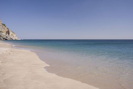 Beautiful view of an idyllic empty beach in summertimeの写真素材
