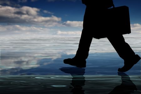 businessman isolated on water with reflectionの写真素材