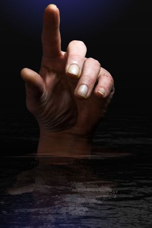 concept image of hand in the water finger pointing