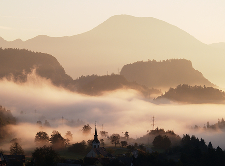 Early morning mist in the valleyの写真素材
