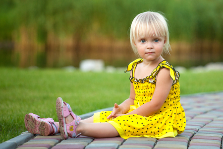 Beautiful blonde girl outsideの写真素材