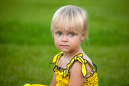 Beautiful blonde girl outsideの写真素材
