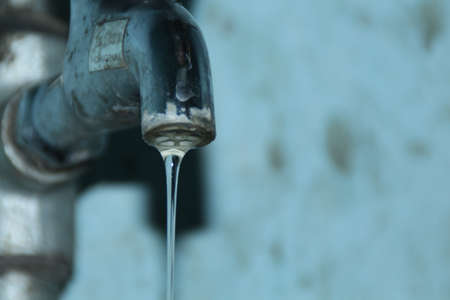 Water drop sprite on pipeの写真素材