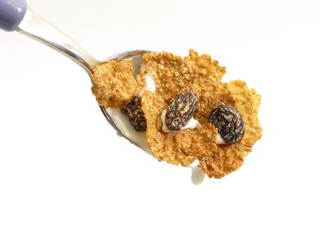 Spoon full of cereal,milk and raisinsの写真素材