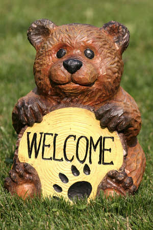 Garden bear lawn figure with welcome signの写真素材