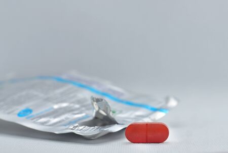 Pill blister pack isolated on white background. Realistic of foil packaging with tablets and one...